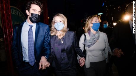Elizabeth Holmes walks outside of federal court after she was found guilty on 4 of 11 accounts faced in her fraud trial in San Jose, California, January 3, 2022. 