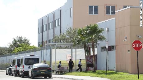 Court deputies exit vans that transported jurors to Marjory Stoneman Douglas High School in Parkland, Florida, on Thursday to view the 1200 building, the crime scene where the 2018 shooting took place.