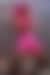 Lil Nas X wearing a metallic pink skirt during a concert.