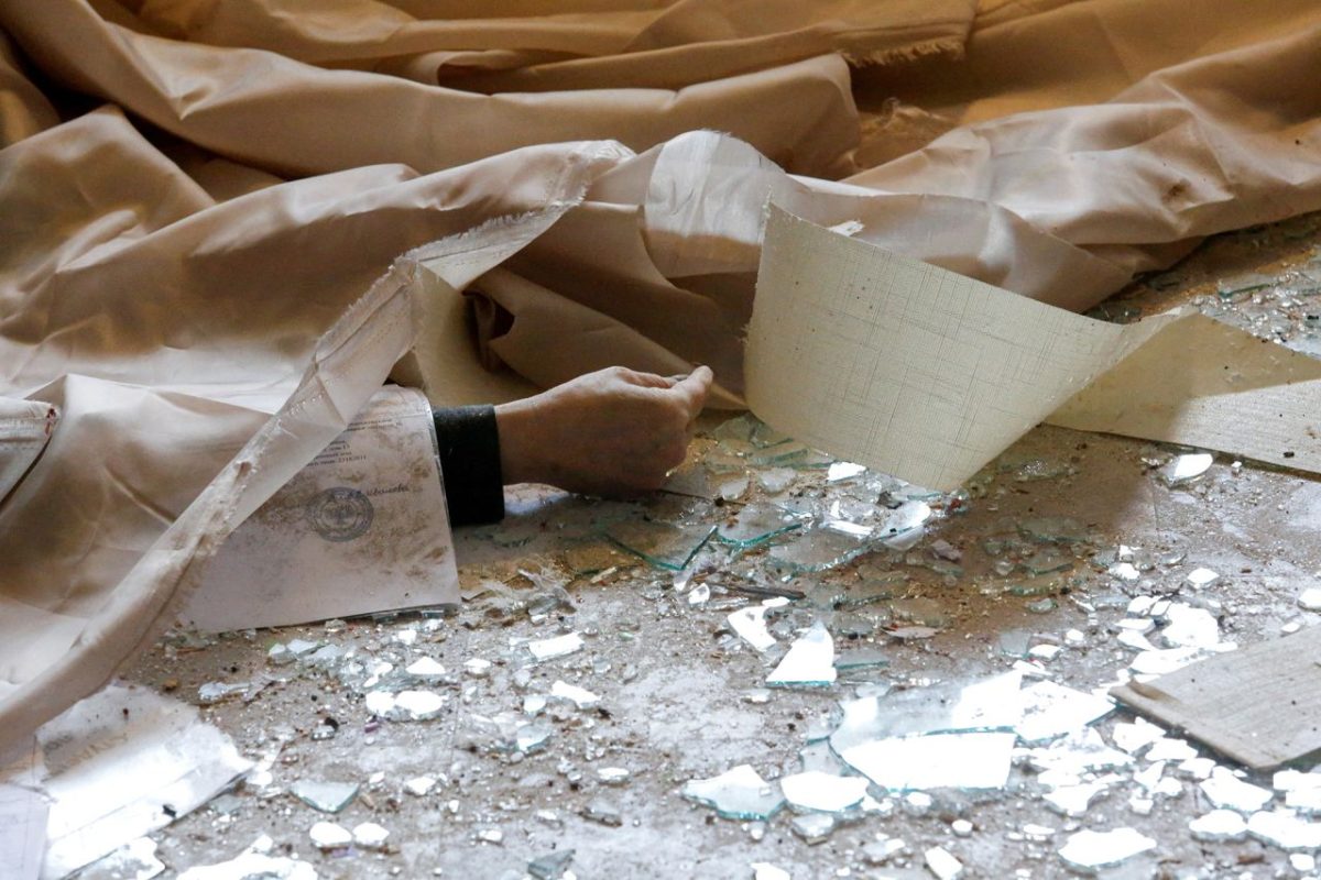 The body of a school employee, who according to locals was killed in recent shelling, lies in the separatist-controlled town of Horlivka in Ukraine