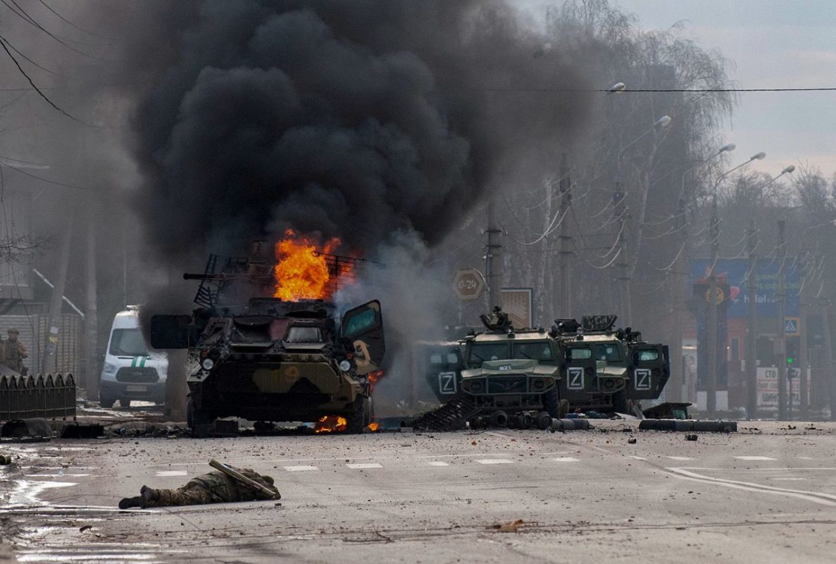 A Russian armored vehicle burns after fighting in Kharkiv on February 27. Street fighting broke out as Russian troops entered Ukraine