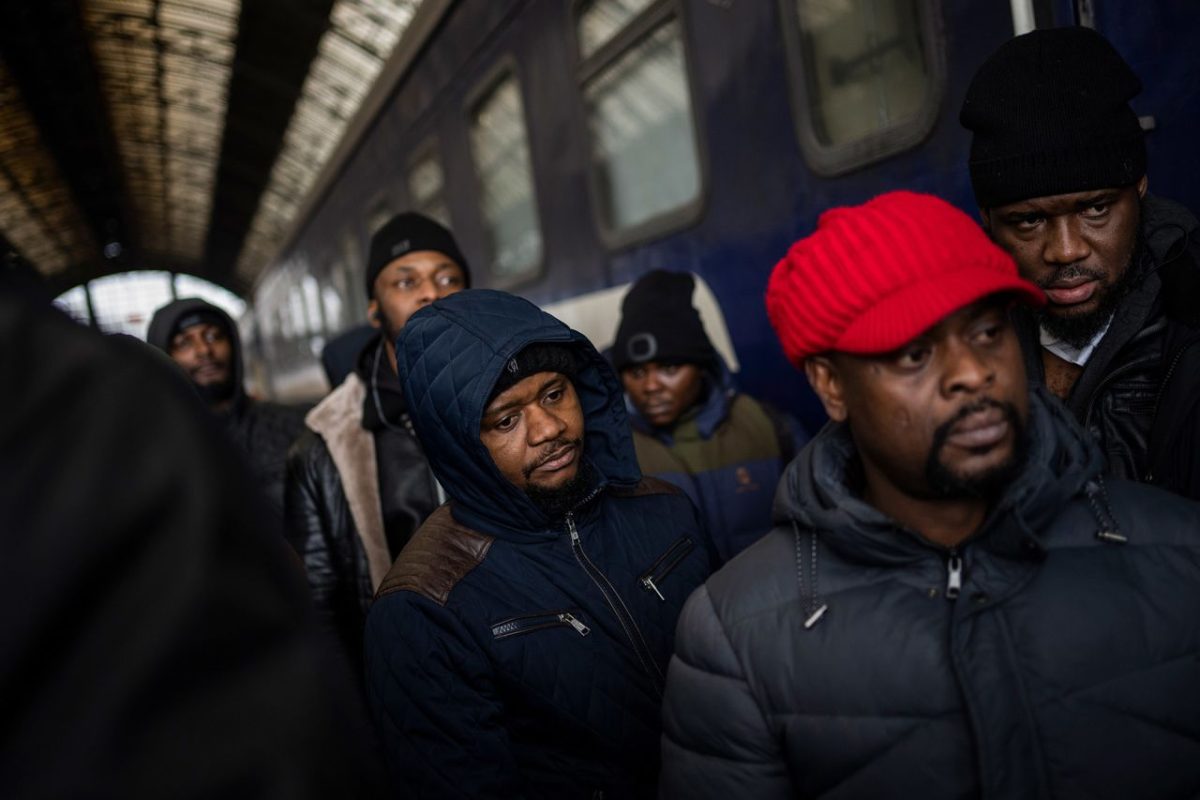 People wait on a platform inside the railway station in Lviv on February 27. Thousands of people at Lviv