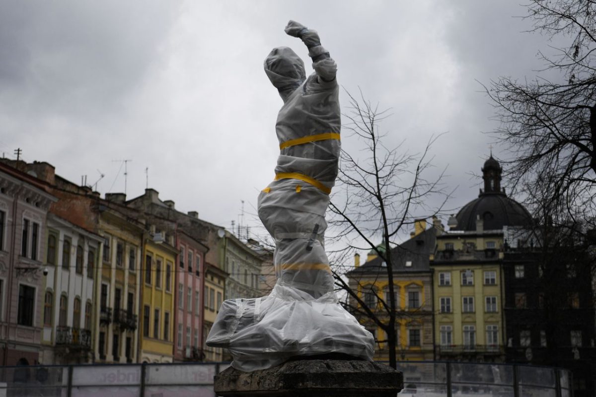 A statue is covered in Lviv on March 5. <a href=
