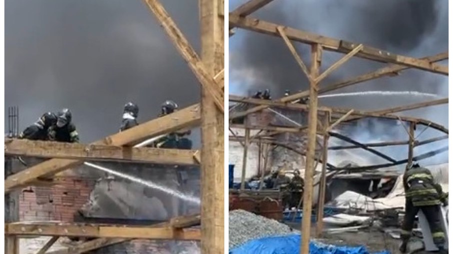 Equipes do Corpo de Bombeiros trabalham no galpão incendiado 